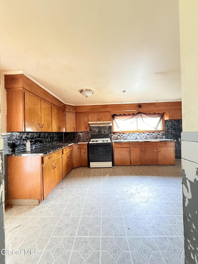 3144 N Thompson St, Rotterdam, NY 12306 - kitchen featuring white range with gas cooktop, backsplash, and brown cabinets