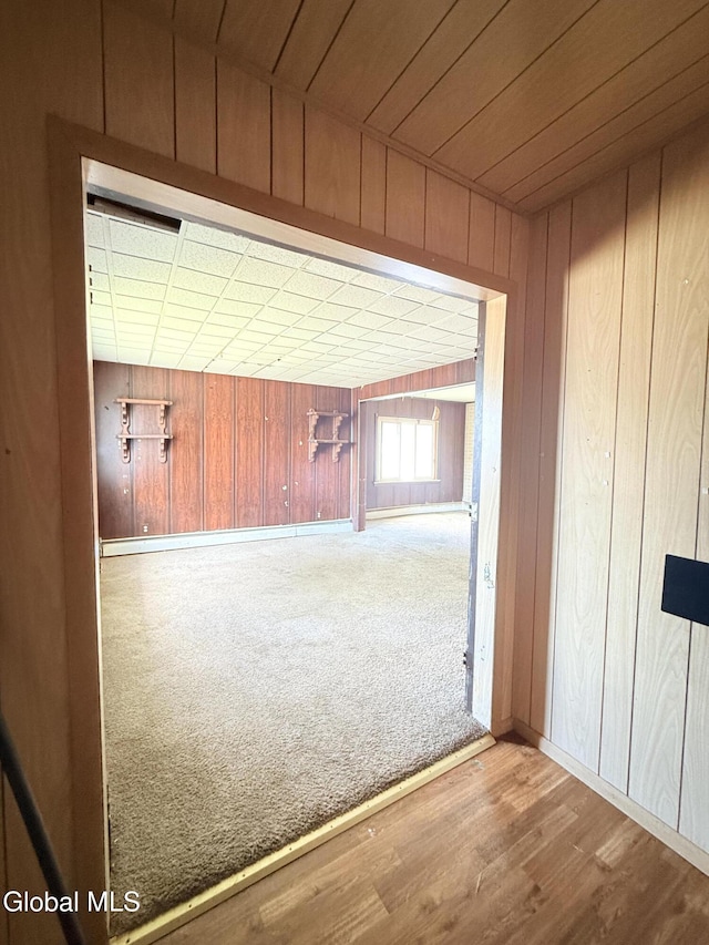 3144 N Thompson St, Rotterdam, NY 12306 - hallway featuring wooden walls and wood finished floors