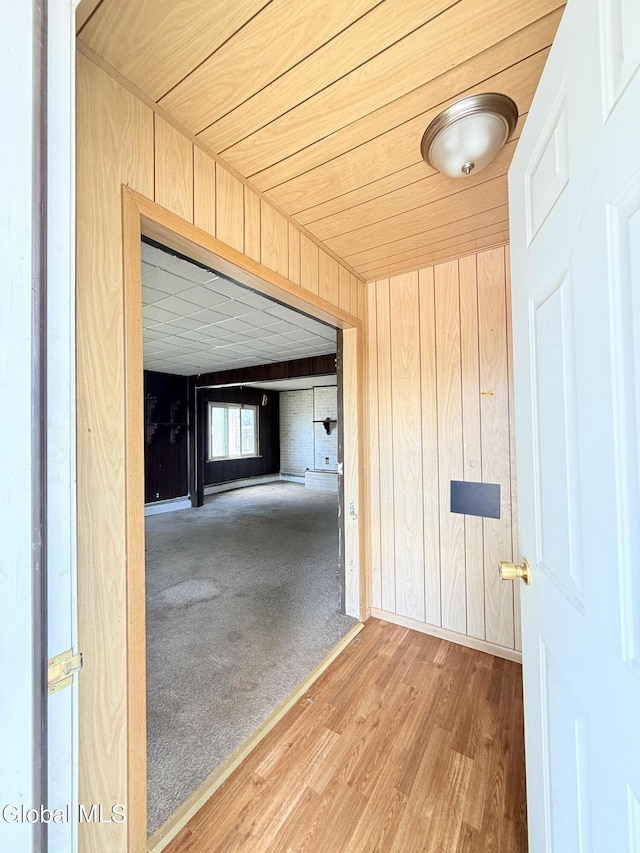 3144 N Thompson St, Rotterdam, NY 12306 - hall featuring wooden walls and wood finished floors