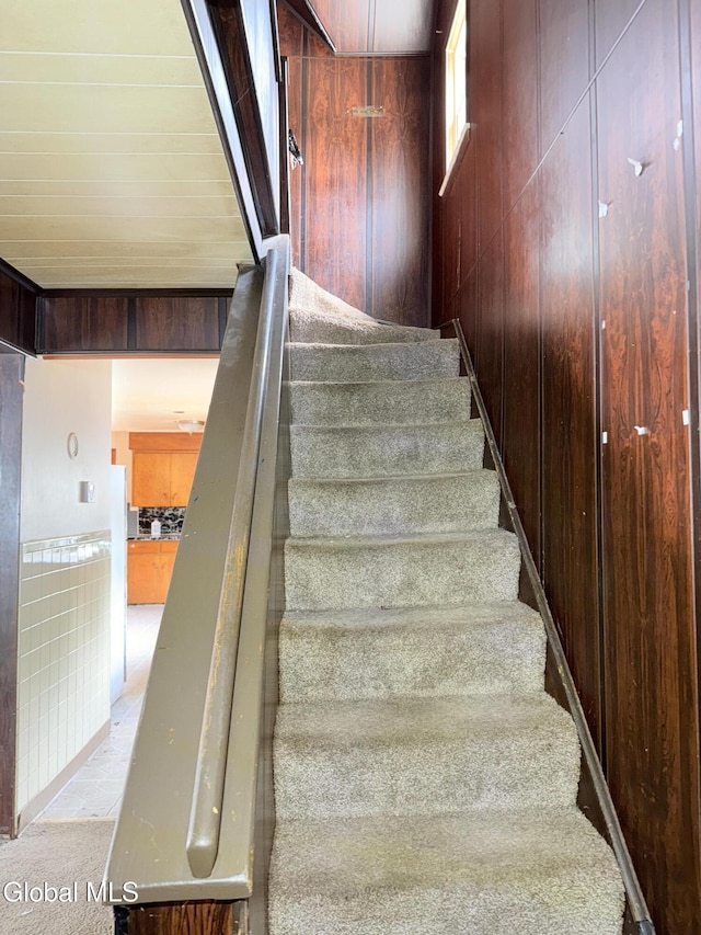 3144 N Thompson St, Rotterdam, NY 12306 - stairway featuring carpet and wood walls