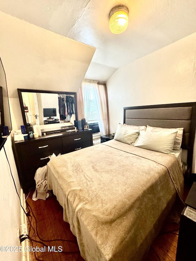 bedroom featuring wood finished floors