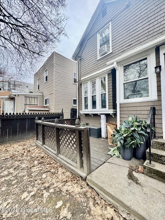 rear view of property with fence