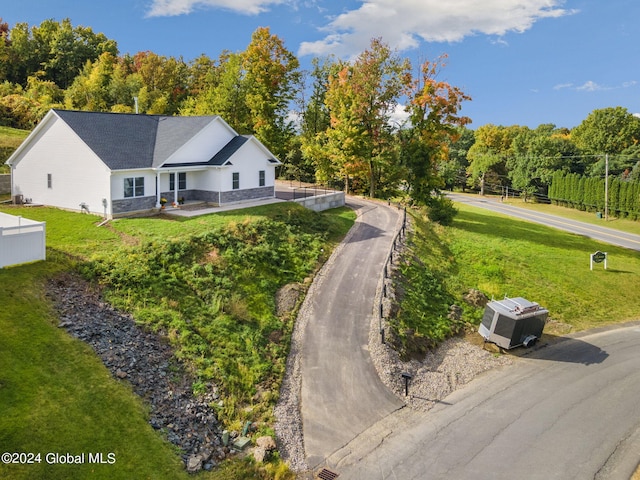 single story home featuring a front lawn and fence