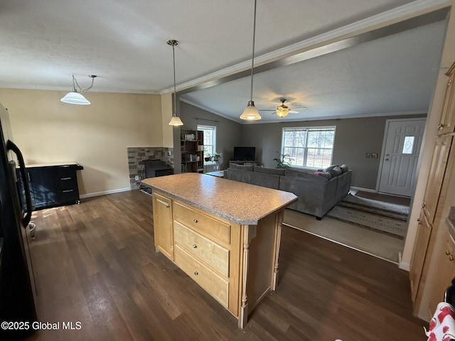 kitchen featuring light brown cabinets, dark wood finished floors, a ceiling fan, and ornamental molding