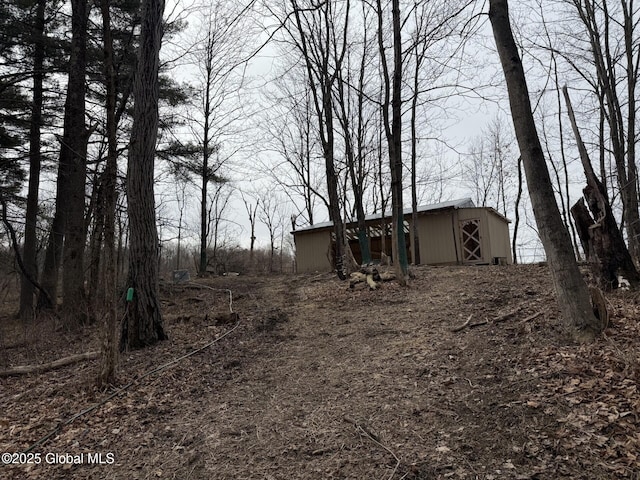 exterior space with an outdoor structure and a pole building