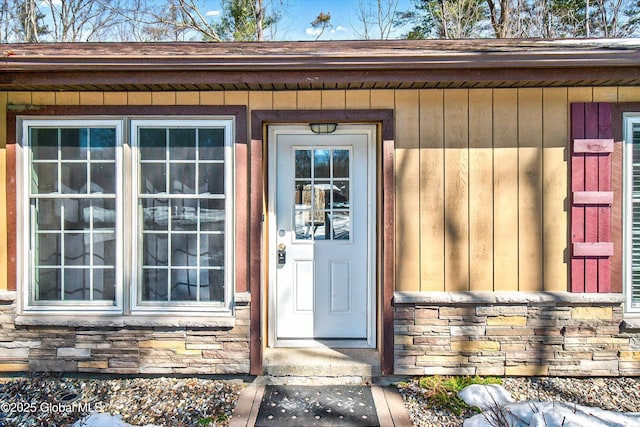 view of exterior entry with stone siding