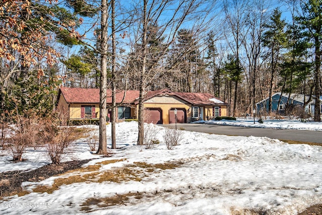 view of front of home featuring driveway and an attached garage