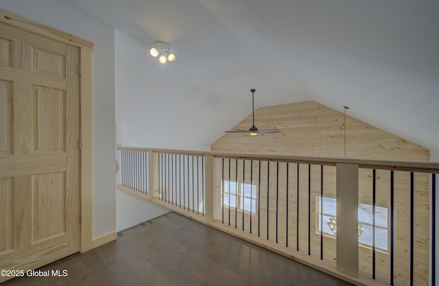 hallway featuring vaulted ceiling and wood finished floors