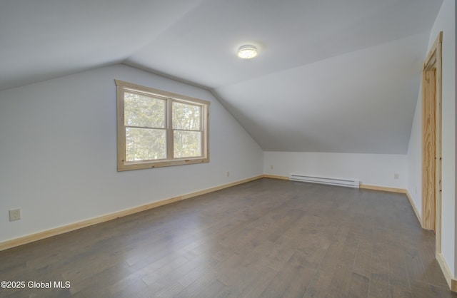 bonus room featuring baseboards, a baseboard heating unit, lofted ceiling, and wood finished floors