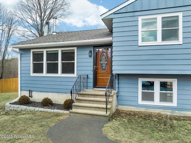 1263 Best Rd, East Greenbush, NY 12061 - view of front of property with a shingled roof, fence, and a chimney