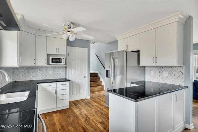 1263 Best Rd, East Greenbush, NY 12061 - kitchen with a sink, stainless steel fridge, range with electric stovetop, ceiling fan, and white microwave
