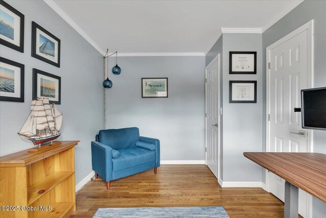 1263 Best Rd, East Greenbush, NY 12061 - sitting room featuring crown molding, baseboards, and wood finished floors