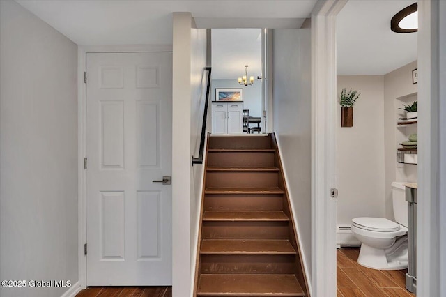 1263 Best Rd, East Greenbush, NY 12061 - stairs featuring a baseboard radiator, an inviting chandelier, and wood finished floors