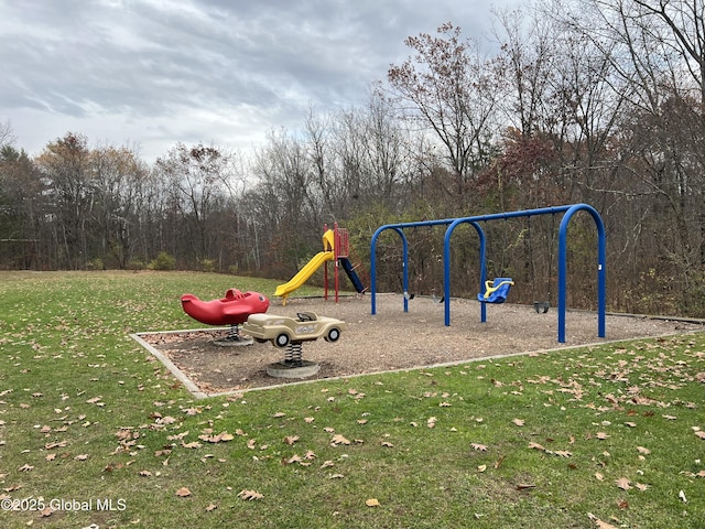 community jungle gym featuring a yard