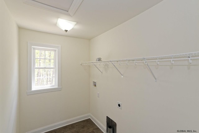 washroom with baseboards, hookup for an electric dryer, laundry area, dark wood-style flooring, and washer hookup