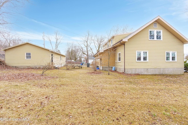 view of home's exterior featuring a yard