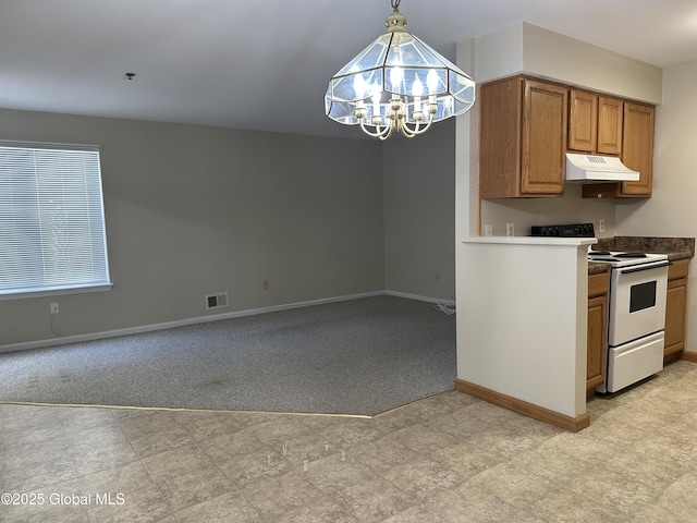 kitchen featuring visible vents, white range with electric cooktop, under cabinet range hood, brown cabinets, and an inviting chandelier