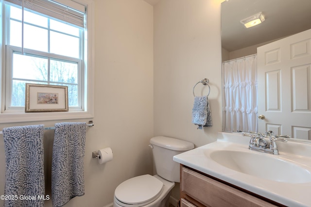 full bath with toilet and vanity