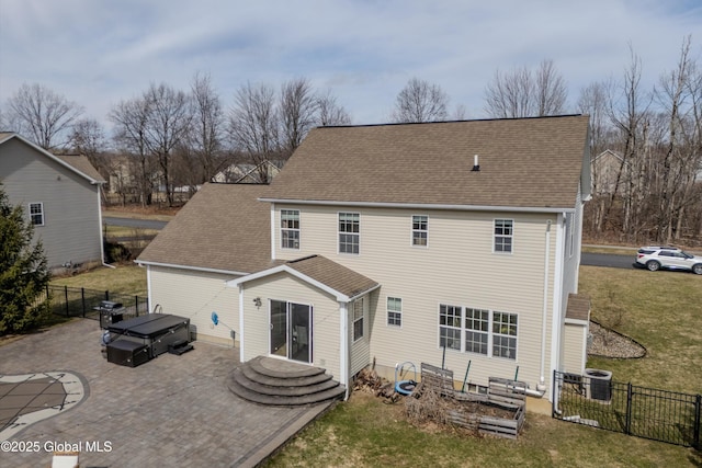 back of house with fence, a patio, central AC, roof with shingles, and a lawn