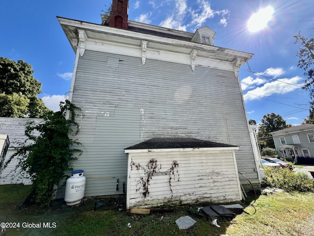 view of home's exterior featuring a chimney