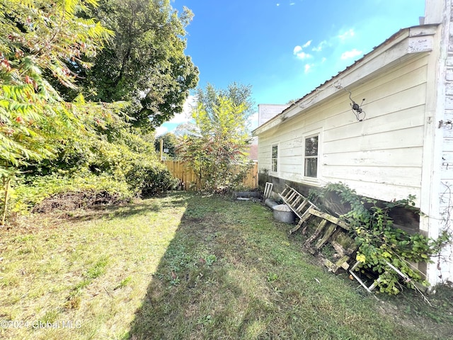 view of yard featuring fence