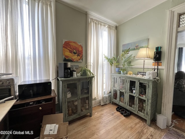 living area with hardwood / wood-style floors