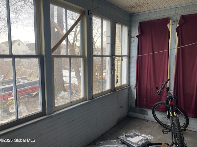 unfurnished sunroom featuring a healthy amount of sunlight