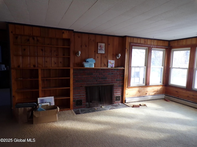 carpeted living area with built in features, wood walls, and a fireplace