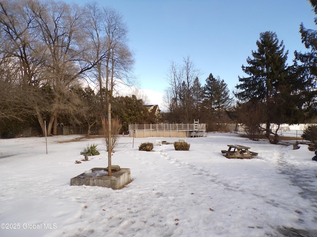 view of yard layered in snow