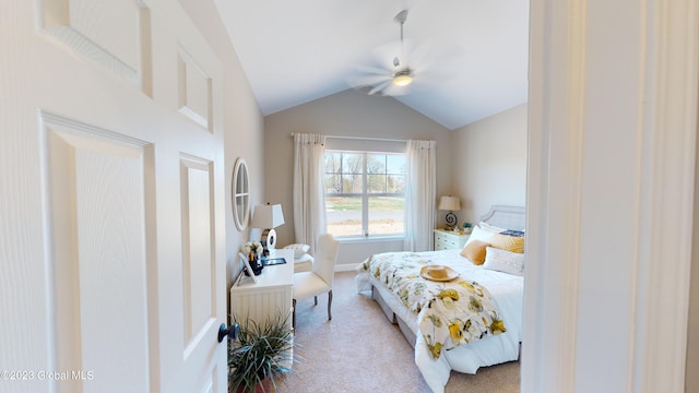 carpeted bedroom with baseboards, ceiling fan, and vaulted ceiling