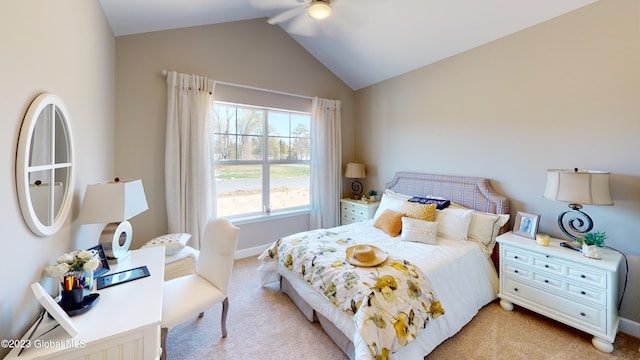 bedroom featuring a ceiling fan, vaulted ceiling, light colored carpet, and baseboards