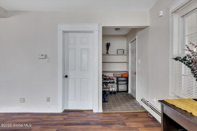 storage area with a baseboard heating unit