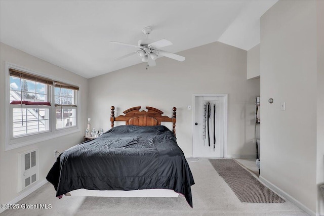 bedroom featuring vaulted ceiling, carpet flooring, baseboards, and ceiling fan