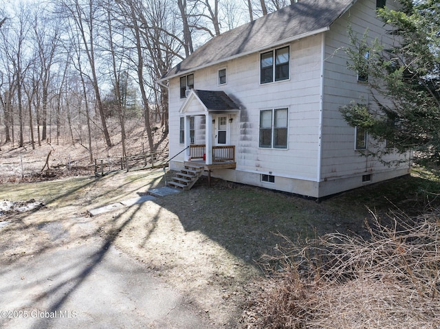 view of front of home featuring roof with shingles