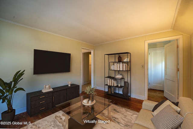 living room with crown molding, wood finished floors, and baseboards