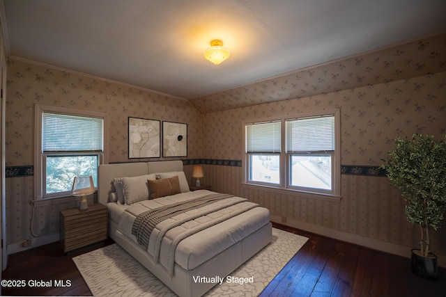 bedroom featuring wallpapered walls, multiple windows, dark wood-style flooring, and ornamental molding