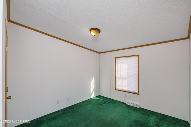 spare room featuring visible vents, a textured ceiling, crown molding, and carpet