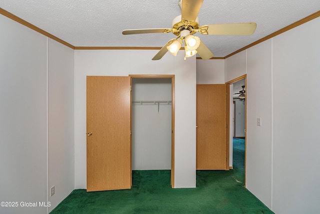 unfurnished bedroom with a textured ceiling, carpet, and ornamental molding