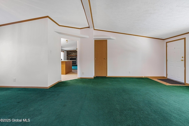 unfurnished room featuring a textured ceiling, crown molding, and carpet