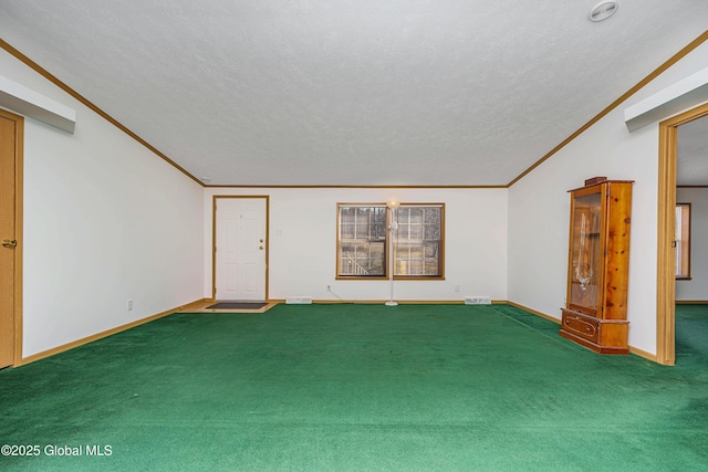 unfurnished room featuring baseboards, a textured ceiling, carpet, and ornamental molding