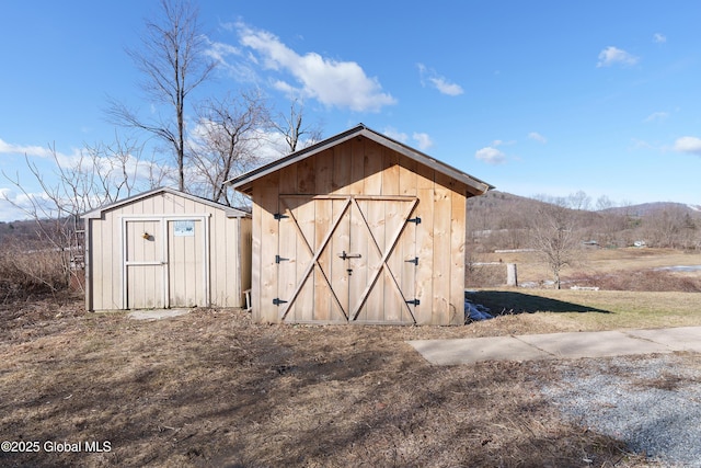 view of shed with a mountain view