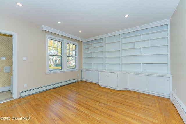 unfurnished room featuring a baseboard heating unit, built in features, recessed lighting, and light wood finished floors