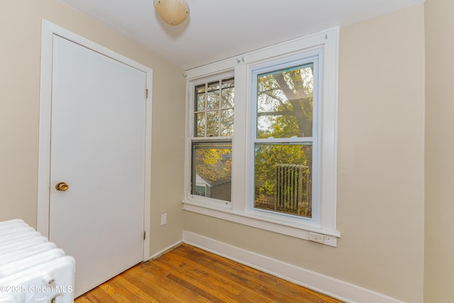 unfurnished bedroom featuring baseboards and wood finished floors