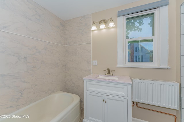 bathroom with vanity and radiator heating unit