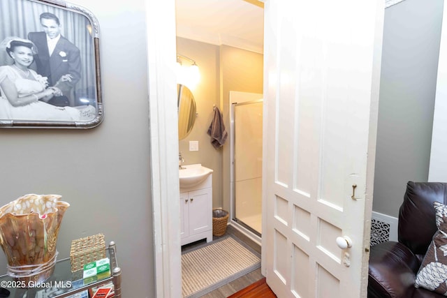 47 Church St, Amsterdam, NY 12010 - bathroom featuring vanity, wood finished floors, and a shower stall