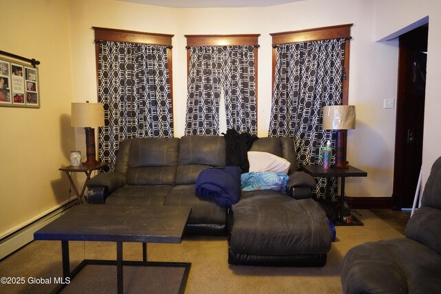 living area featuring a baseboard radiator and baseboards