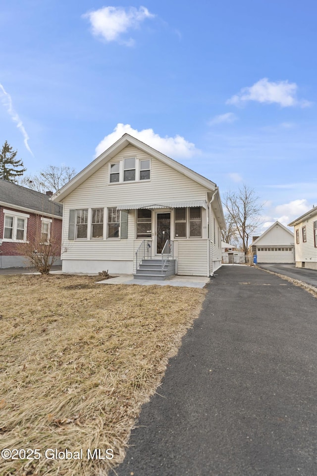 bungalow-style house featuring entry steps