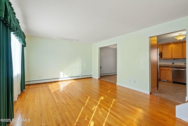 unfurnished living room featuring light wood-style floors, baseboards, and a baseboard radiator