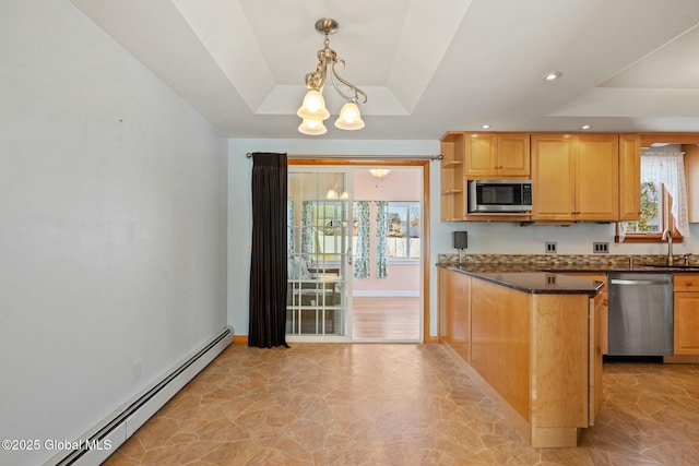 kitchen with a raised ceiling, baseboard heating, dark countertops, and appliances with stainless steel finishes