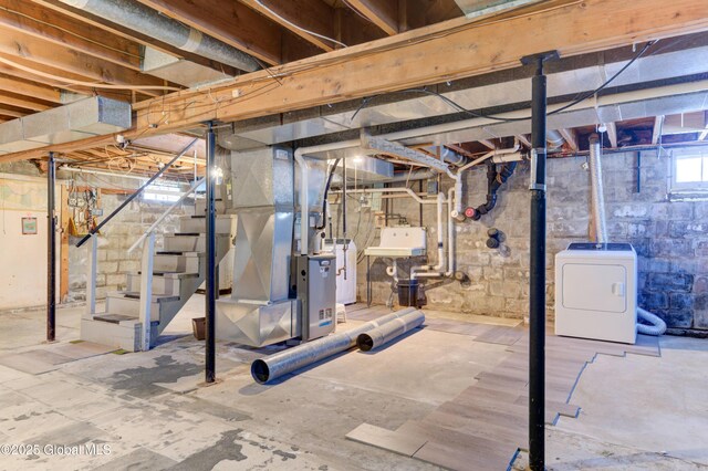 basement featuring stairway, water heater, washer / dryer, heating unit, and a sink